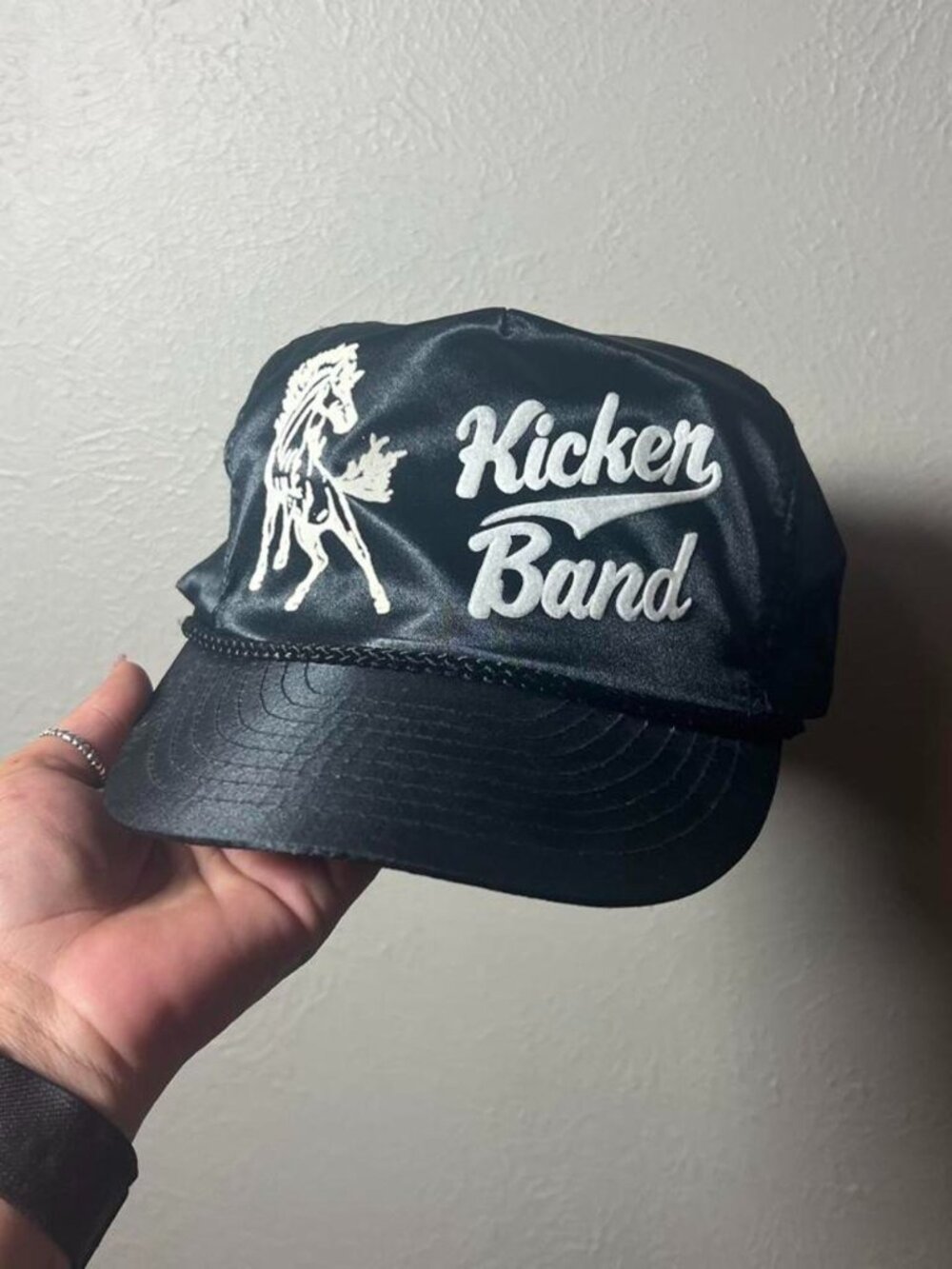 Vintage Shiny Kicker Band Black Snapback trucker cap with white graphics